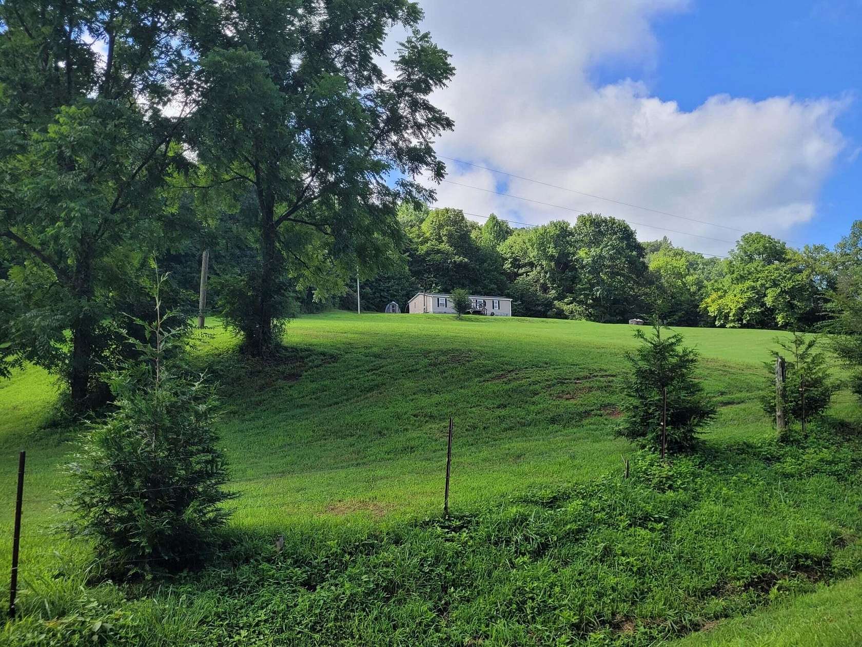 10.4 Acres of Recreational Land with Home for Sale in Riceville, Tennessee