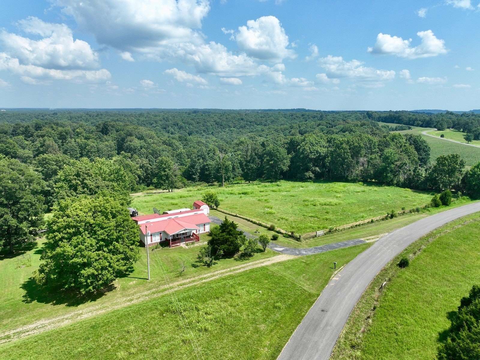 25.3 Acres of Land with Home for Auction in Cerulean, Kentucky