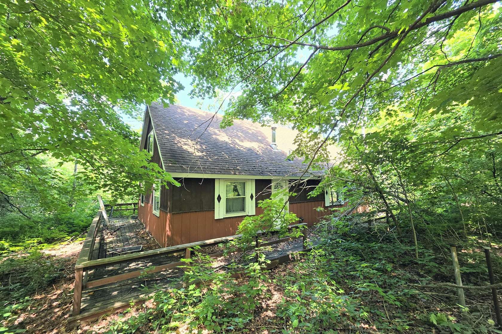 10.5 Acres of Recreational Land with Home for Sale in Elmira, Michigan
