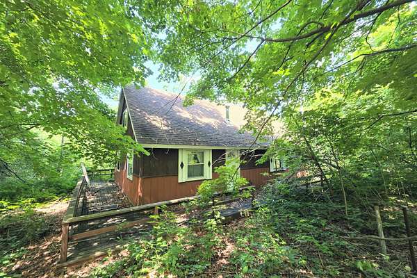 10.5 Acres of Recreational Land with Home for Sale in Elmira, Michigan