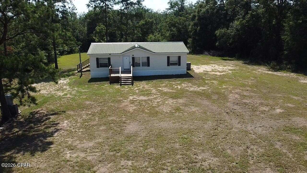 1.56 Acres of Land with Home for Sale in Marianna, Florida