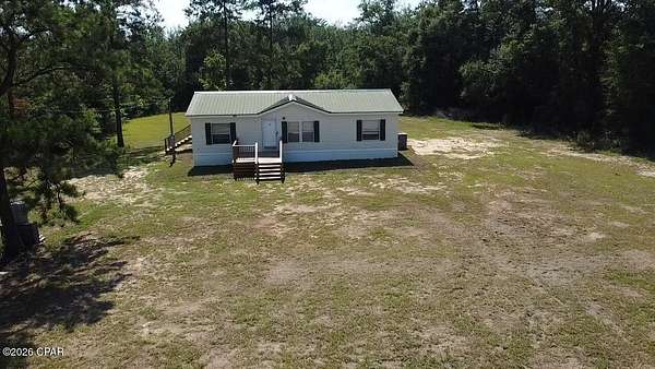 1.56 Acres of Land with Home for Sale in Marianna, Florida
