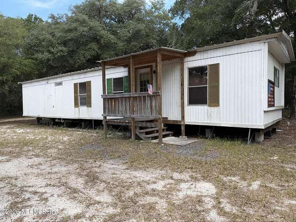 5 Acres of Land with Home for Sale in Pomona Park, Florida