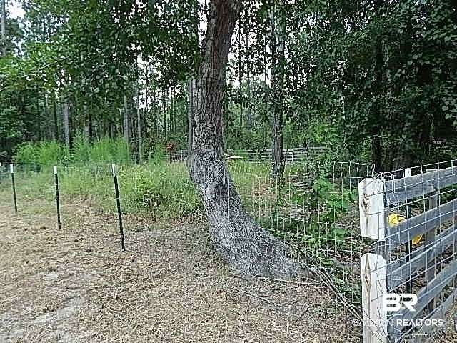 6.6 Acres of Land with Home for Auction in Robertsdale, Alabama