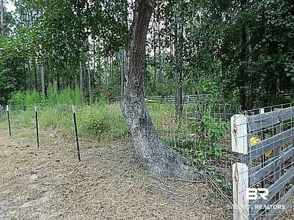 6.6 Acres of Land with Home for Auction in Robertsdale, Alabama
