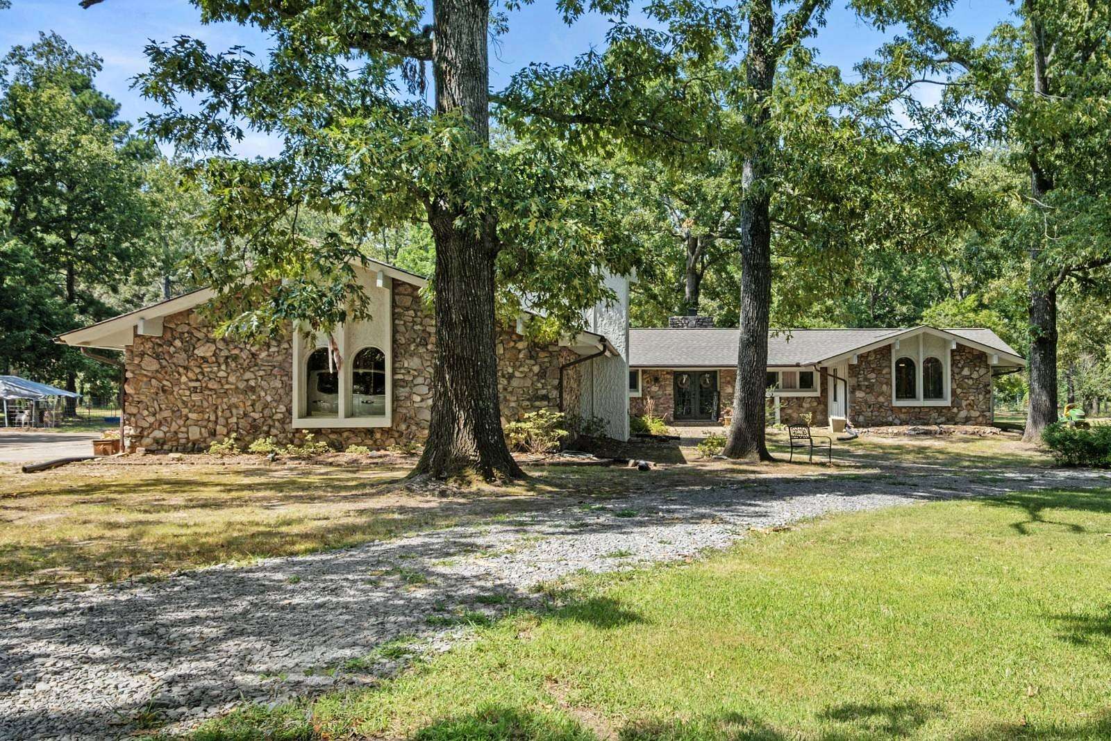 7.7 Acres of Land with Home for Auction in Redfield, Arkansas