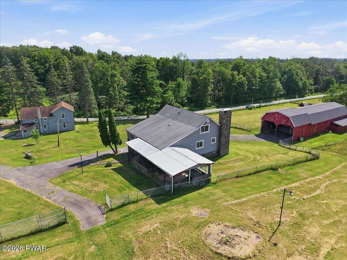 76.4 Acres of Land with Home for Sale in Beach Lake, Pennsylvania