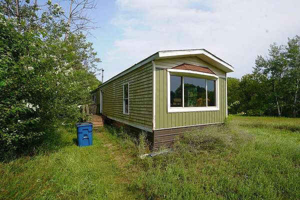 7 Acres of Land with Home for Sale in Stanton, Michigan