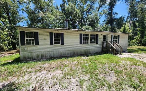 4.86 Acres of Land with Home for Sale in Live Oak, Florida