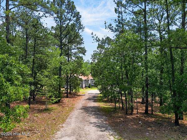 6.87 Acres of Land with Home for Sale in Aberdeen, North Carolina