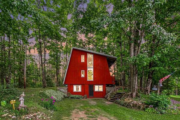 30 Acres of Recreational Land with Home for Sale in Boyne Falls, Michigan