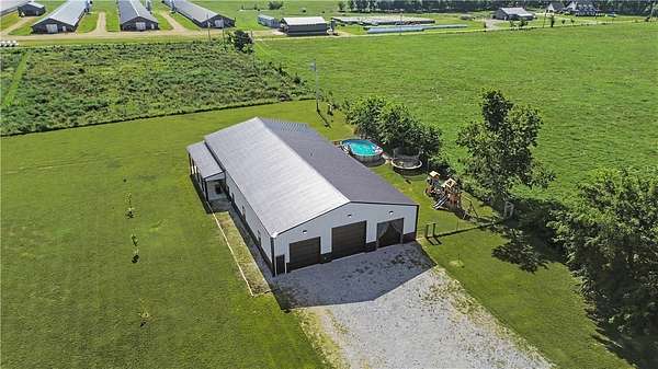 10 Acres of Recreational Land with Home for Sale in Gravette, Arkansas