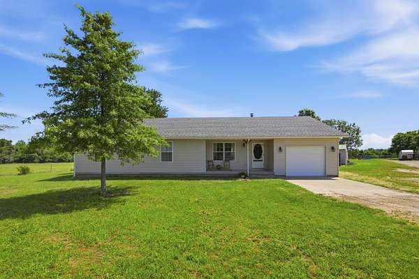 68.9 Acres of Agricultural Land with Home for Sale in Pierce City, Missouri