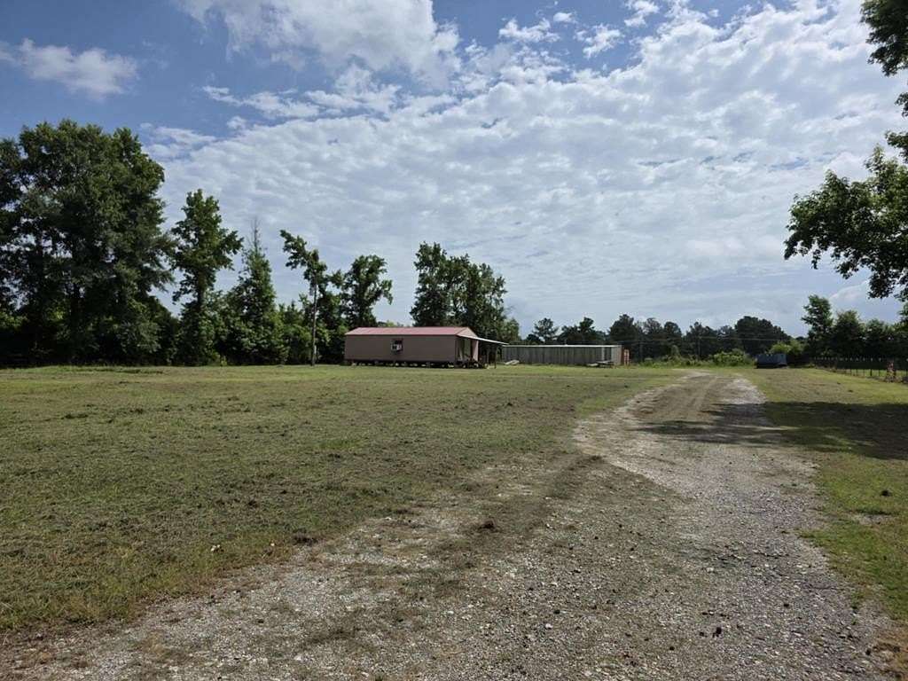 1.58 Acres of Land with Home for Sale in Timpson, Texas