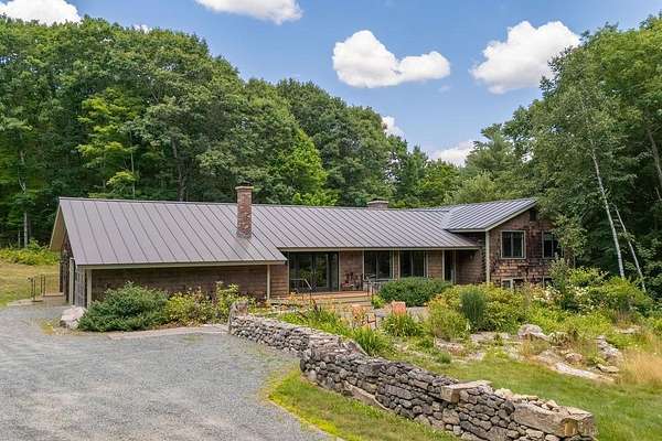 4.64 Acres of Land with Home for Sale in New London, New Hampshire