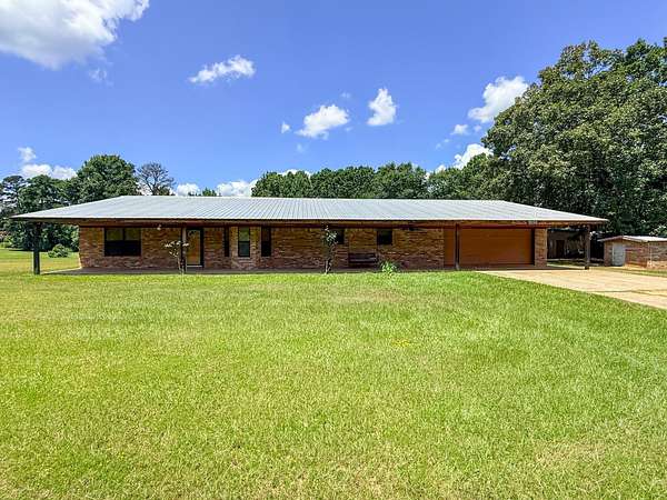 9 Acres of Land with Home for Sale in Atlanta, Texas