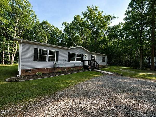 7.55 Acres of Land with Home for Sale in Hurdle Mills, North Carolina