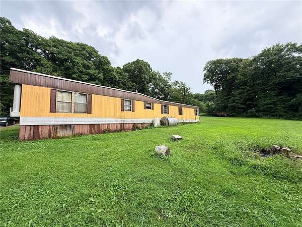 2 Acres of Land with Home for Sale in Mill Run, Pennsylvania