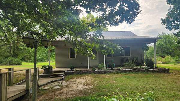 20.3 Acres of Recreational Land with Home for Sale in Sims, Arkansas