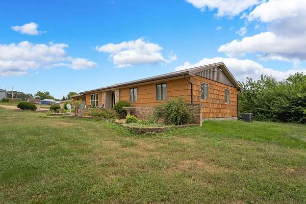 80 Acres of Agricultural Land with Home for Sale in Norwood, Missouri