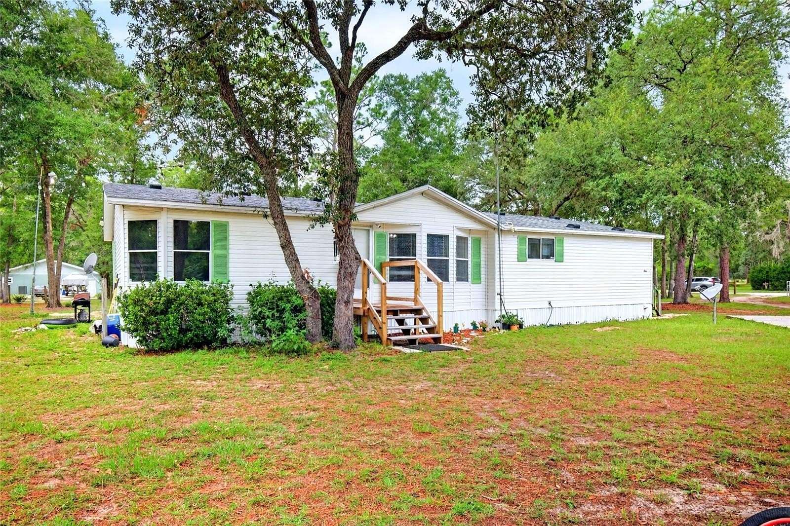 2.63 Acres of Land with Home for Sale in Archer, Florida