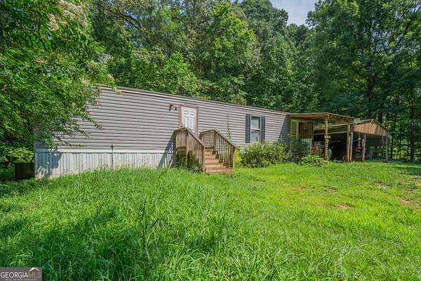 1.8 Acres of Land with Home for Sale in Commerce, Georgia