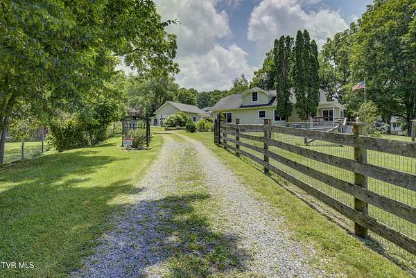 41.6 Acres of Recreational Land with Home for Sale in Roan Mountain, Tennessee