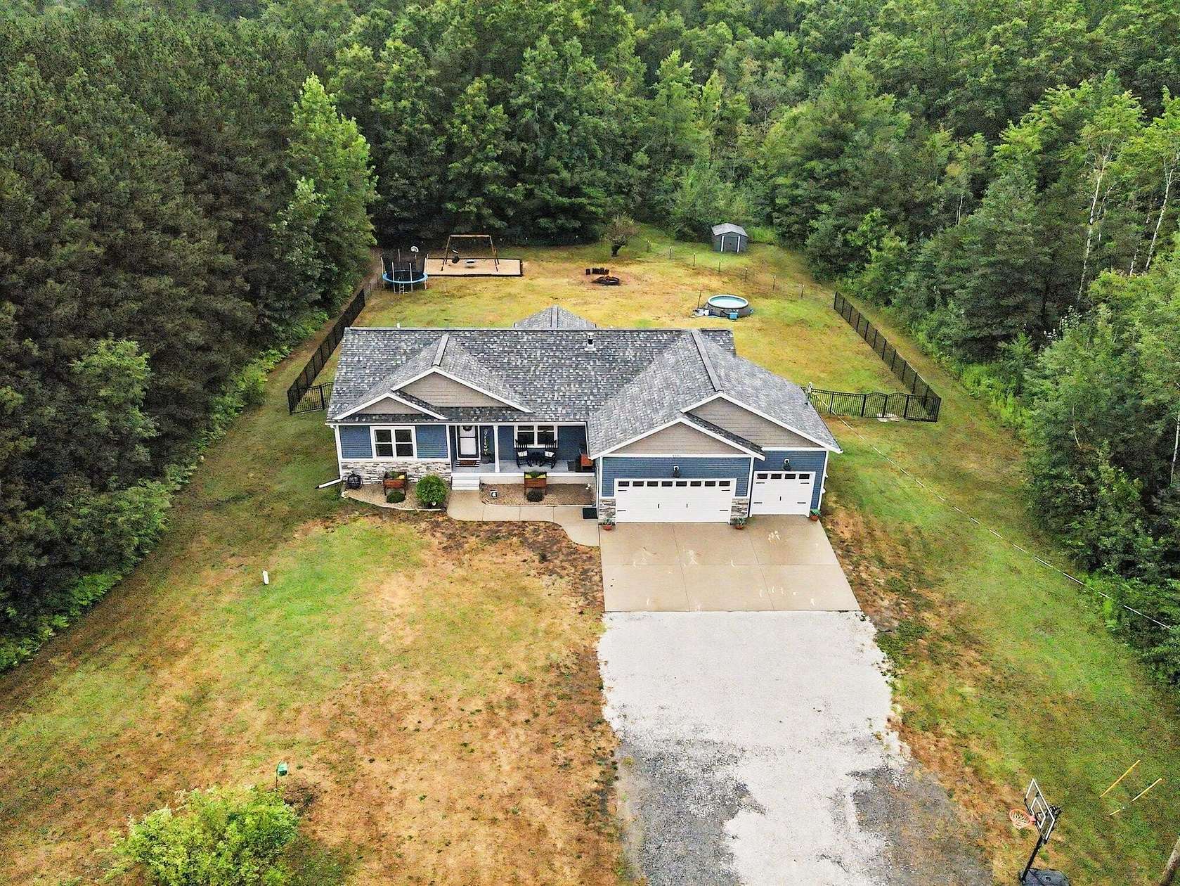 5 Acres of Land with Home for Sale in Fruitport, Michigan
