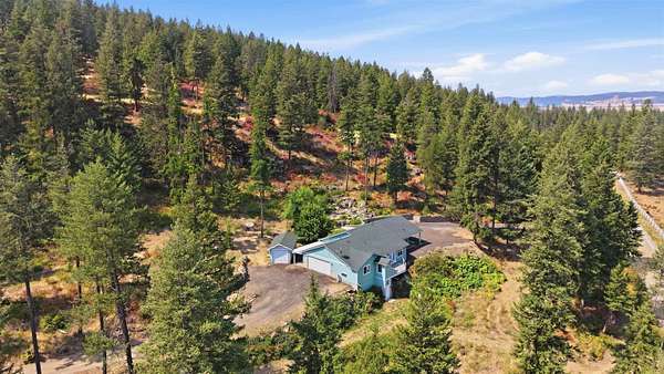 7.57 Acres of Land with Home for Sale in Colbert, Washington