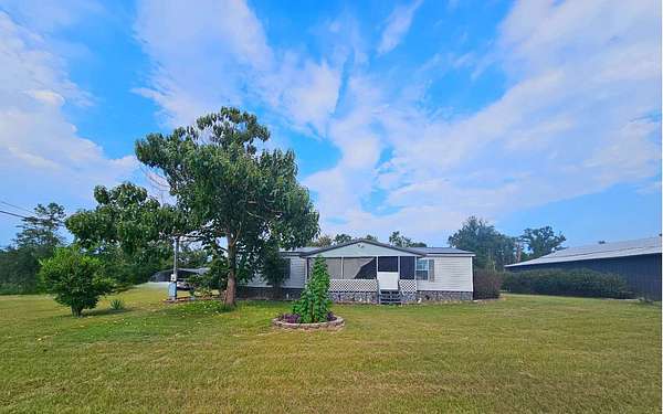 12 Acres of Land with Home for Auction in White Springs, Florida