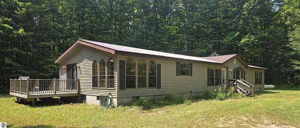 10 Acres of Recreational Land with Home for Sale in Mancelona, Michigan