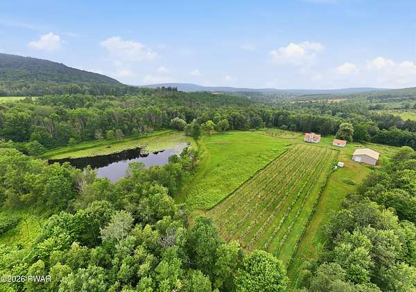 39.4 Acres of Land with Home for Sale in Forest City, Pennsylvania