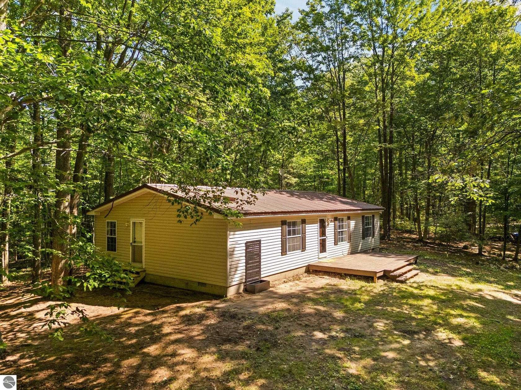10 Acres of Recreational Land with Home for Sale in Lake City, Michigan