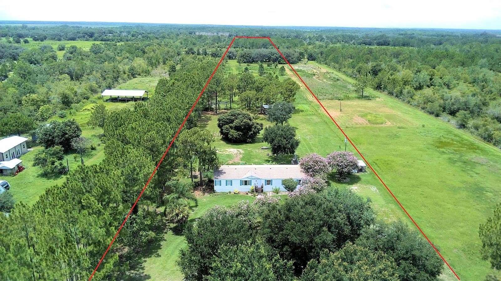 10.4 Acres of Land with Home for Sale in Frostproof, Florida