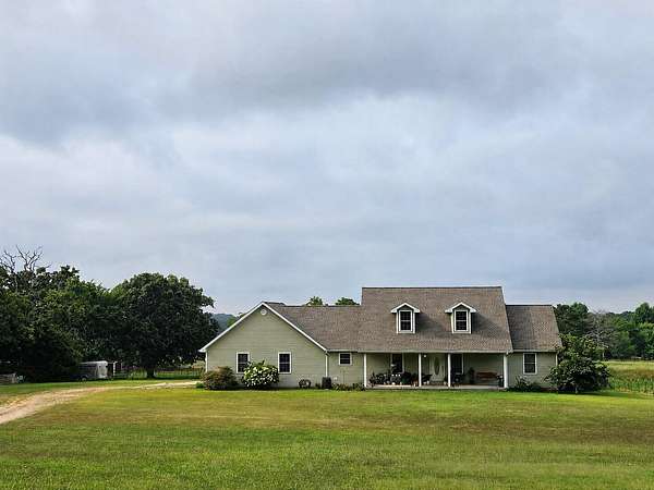 32 Acres of Agricultural Land with Home for Sale in West Plains, Missouri