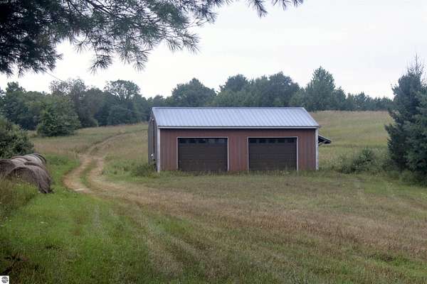 34 Acres of Land for Sale in Kewadin, Michigan