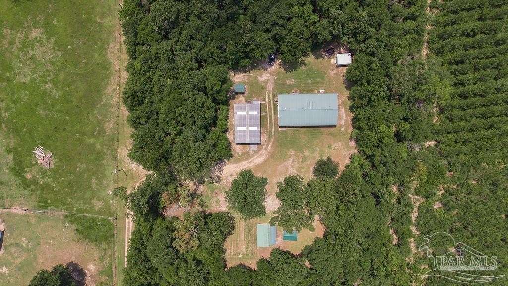 9.1 Acres of Land with Home for Sale in McDavid, Florida