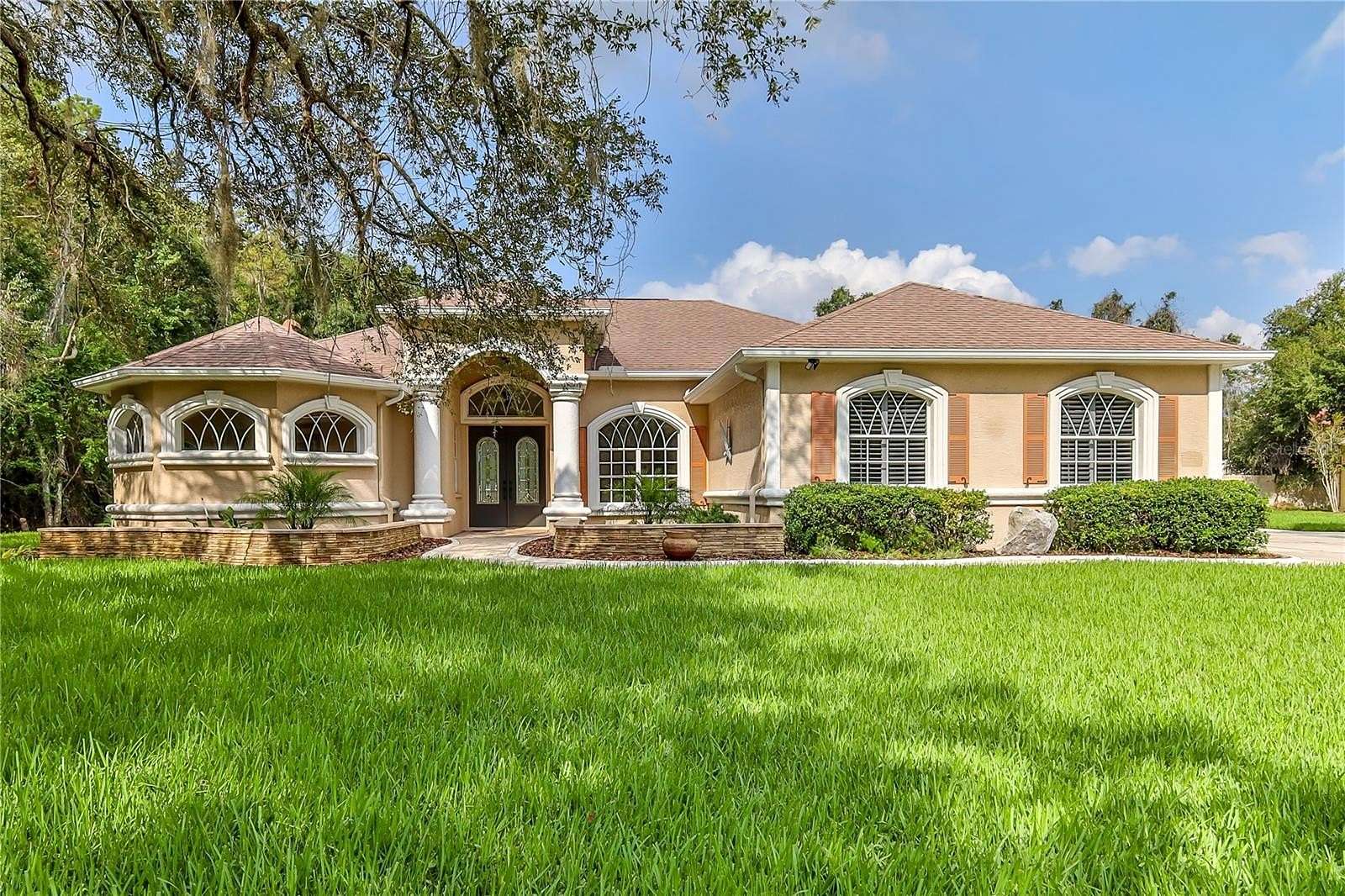 1.5 Acres of Land with Home for Sale in New Port Richey, Florida