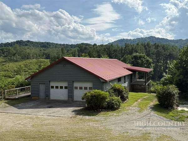 10.5 Acres of Land with Home for Sale in Grassy Creek, North Carolina