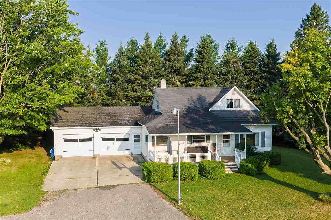 6 Acres of Land with Home for Sale in Charlevoix, Michigan