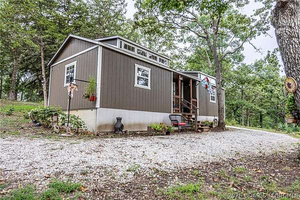 8.2 Acres of Land with Home for Sale in Warsaw, Missouri