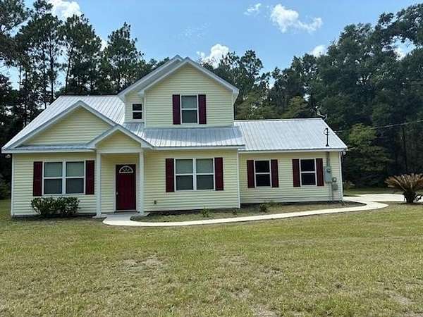 5.23 Acres of Land with Home for Sale in Crawfordville, Florida