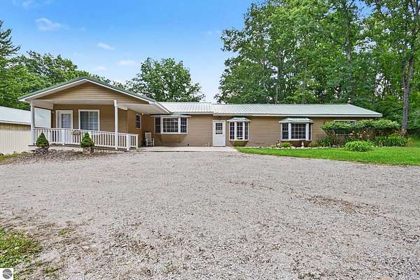 6 Acres of Land with Home for Sale in Long Lake, Michigan