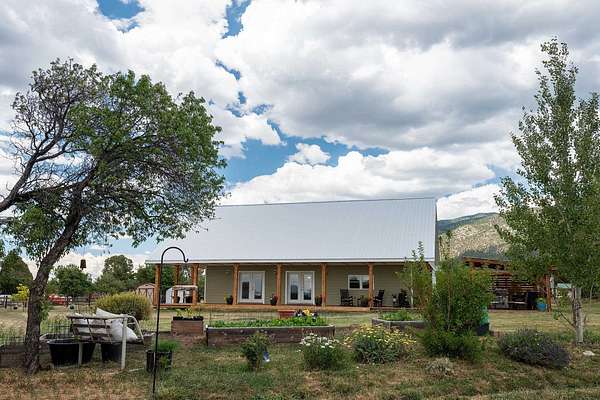 6.89 Acres of Land with Home for Sale in Arroyo Seco, New Mexico