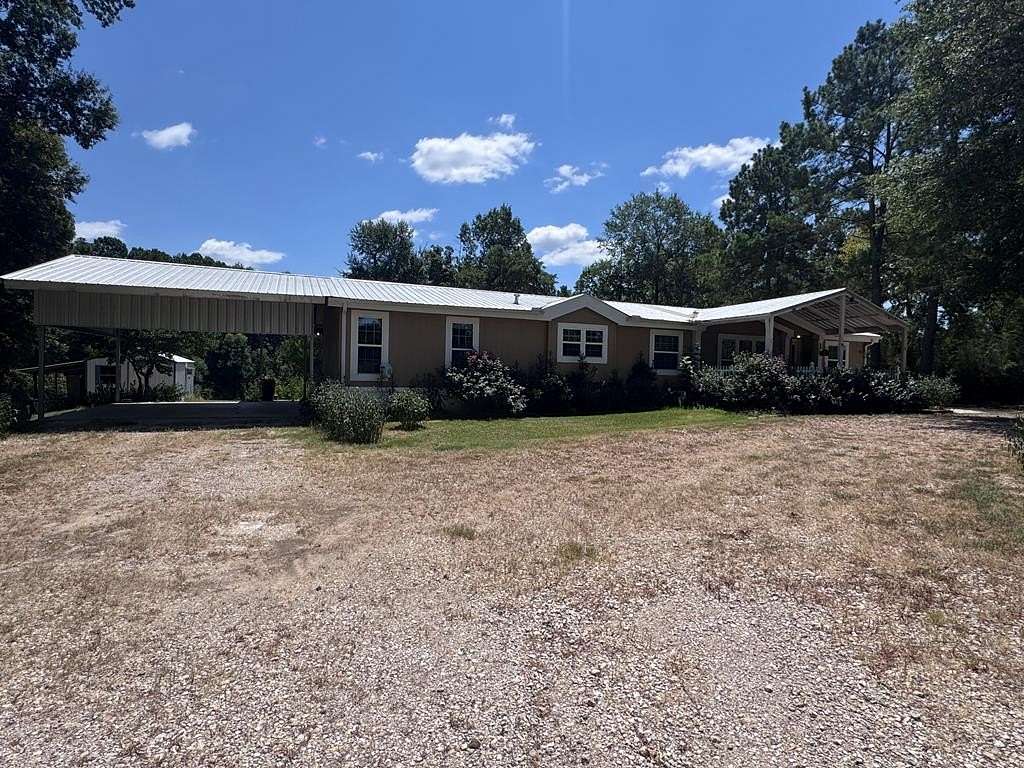 2.63 Acres of Land with Home for Sale in Timpson, Texas