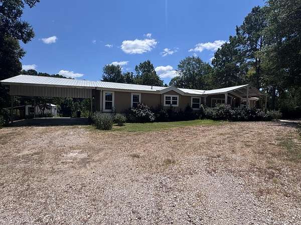 2.63 Acres of Land with Home for Sale in Timpson, Texas