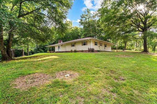 26.7 Acres of Land with Home for Sale in Dalton, Georgia