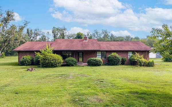 8.37 Acres of Land with Home for Sale in Live Oak, Florida