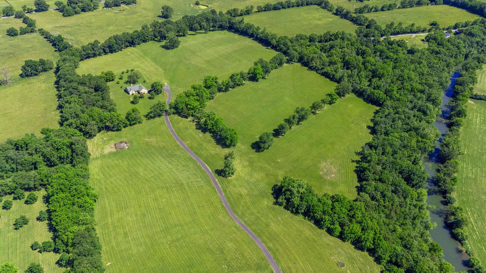 10 Acres of Land with Home for Sale in Midway, Kentucky