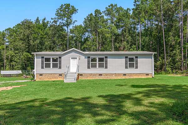 6.29 Acres of Land with Home for Sale in Waterloo, South Carolina
